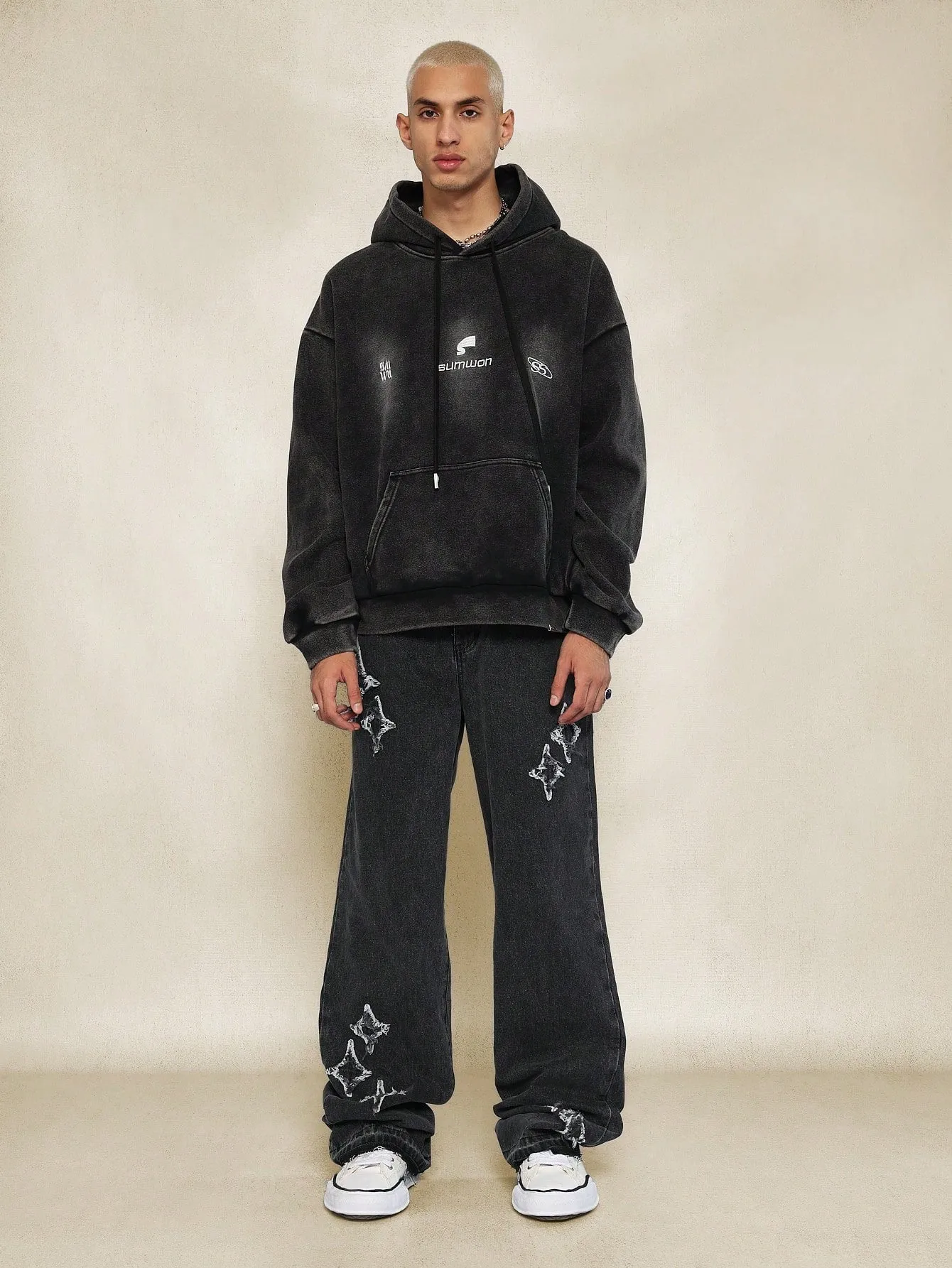 Flare Fit Washed Jean With All Over Distressed Detail